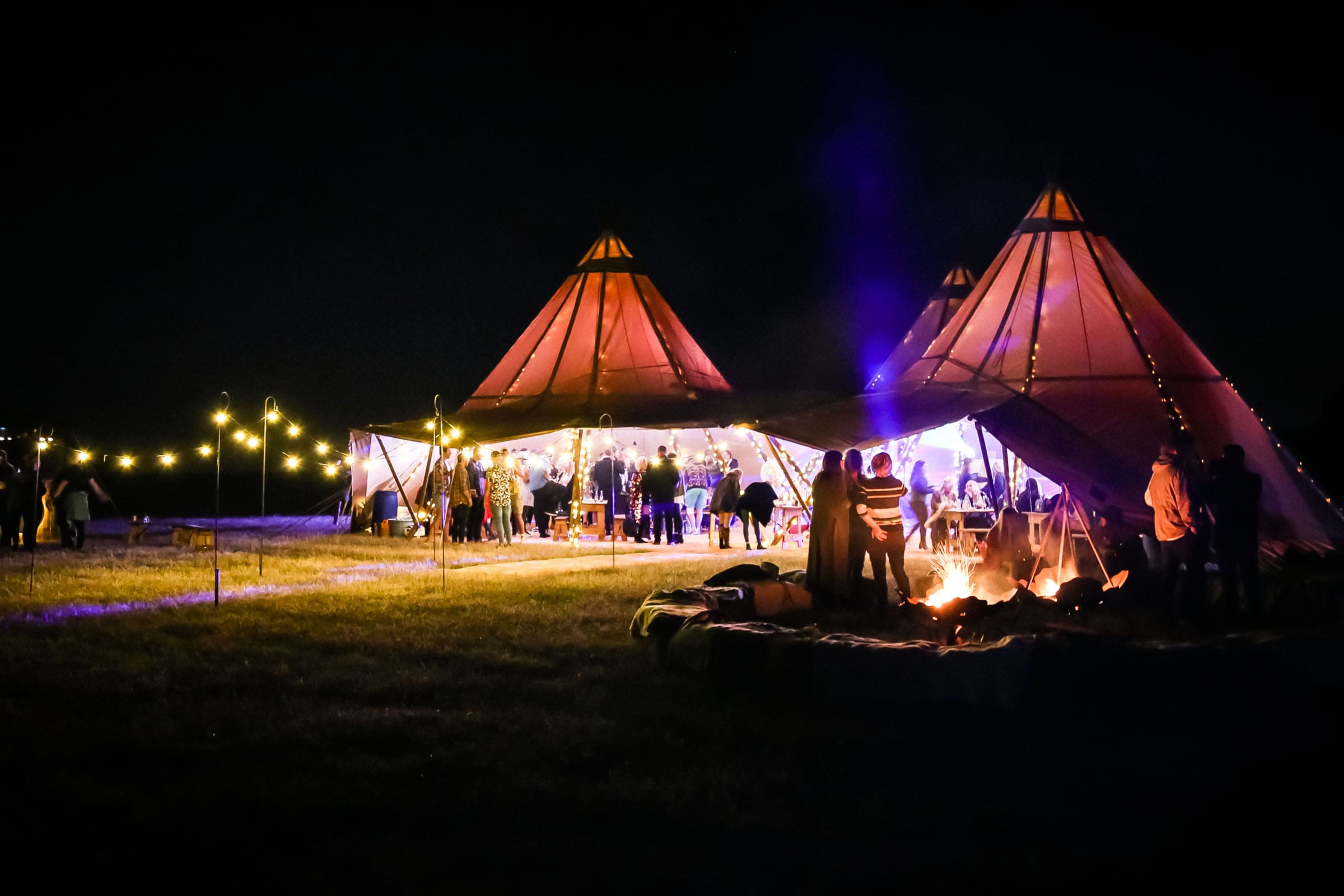 Two Tipis With Round Tables