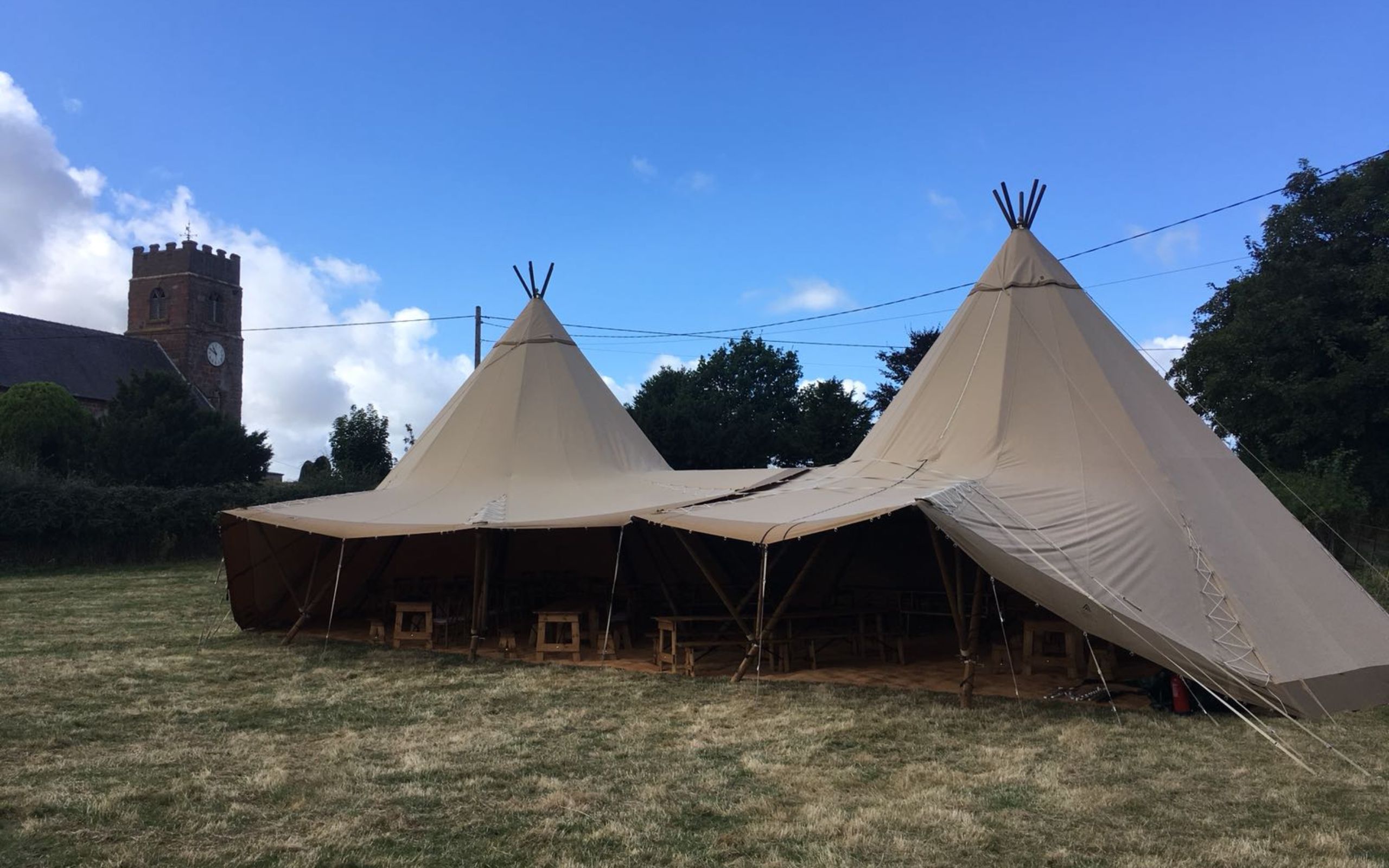 Two Tipis With Round Tables